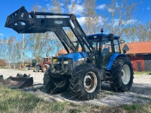 Traktor med frontlastare NEW HOLLAND TM 140 4WD